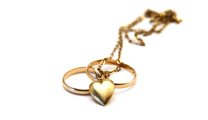 wedding rings and golden heart