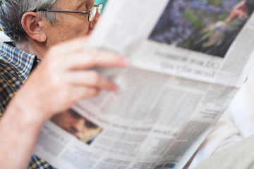 reading newspapers