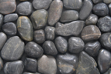 dark polished beach stones.