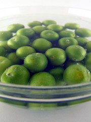 plums in a bowl of water