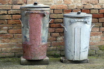two old trash cans