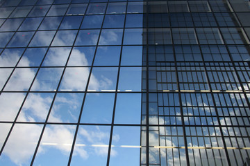 Obraz premium blue sky & coperate glass building.