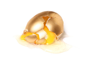 isolated broken golden egg