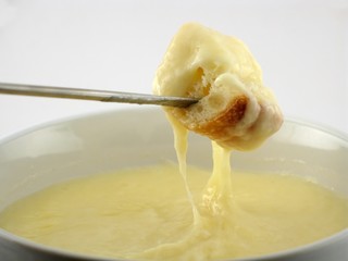 cheese fondue with fork from left