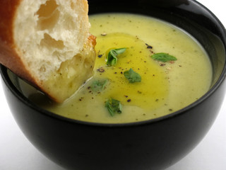 chunk of bread dipped into cream soup