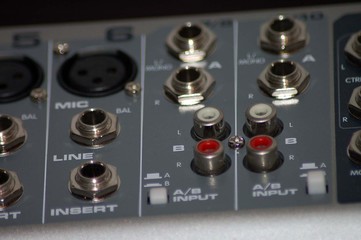 closeup of mixing board inputs