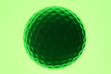 silhouette of a golf ball with a green background.