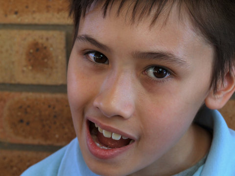 Young Boy Pulling Face