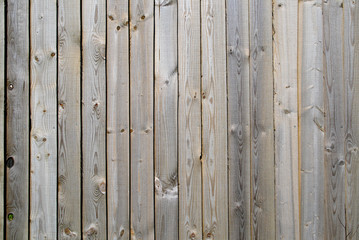 close up of gray wooden fence panels.