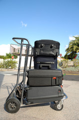 cart an many suitcases