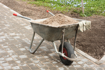 wheelbarrow full of sand
