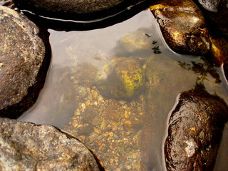 colorful pebbles and rocks in river