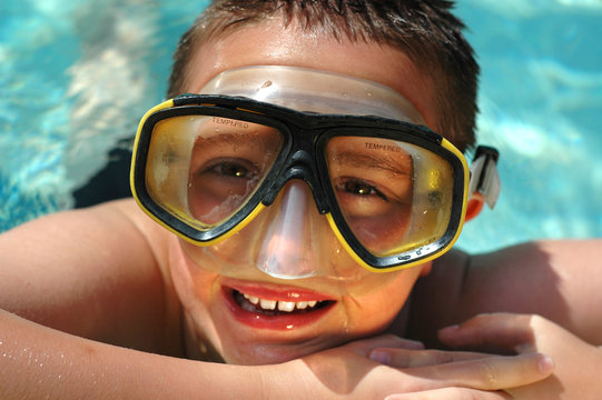 closeup headshot of a kid in a diving mask