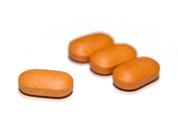 four orange vitamin c tablets