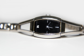 close-up of silver watch with diamond