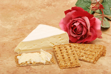 crackers, cheese and rose