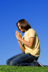 youth kneeling praying, christian faith