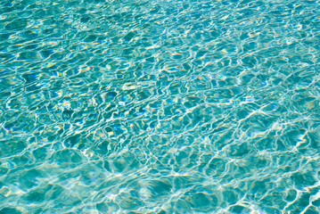 sunlight ripples on calm water