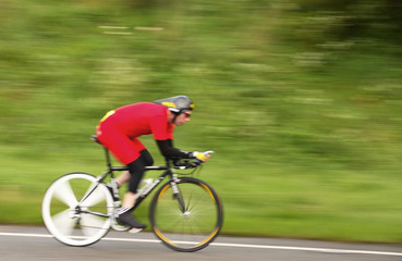 motion blurred racing cyclist