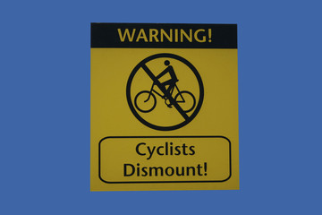 cyclists dismount sign