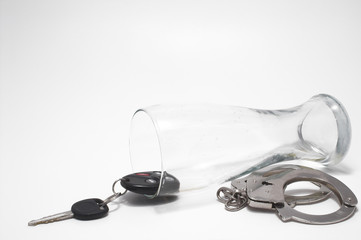 beer, keys and handcuffs - drunk driving concept