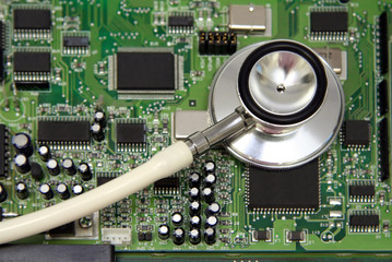 a stethoscope on a computer circuit board