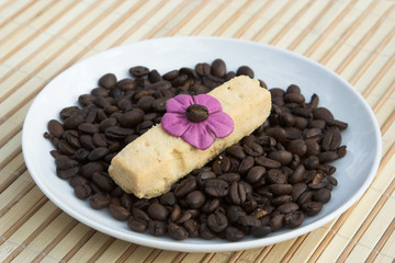 shortbread biscuit on a bed of coffee beans