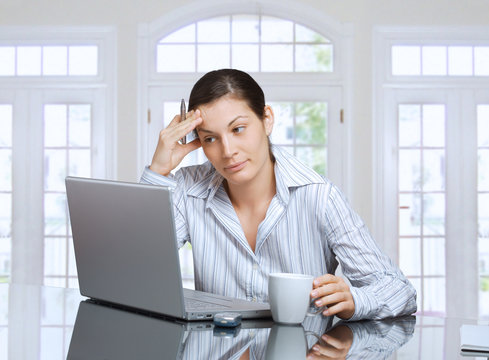 thinking woman with laptop