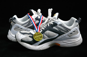 running shoes and gold medal