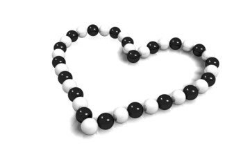 collier coeur perles noir et blanc sur fond blanc