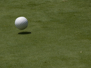 ball and shadow on green