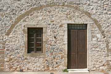 door and window of a stone building