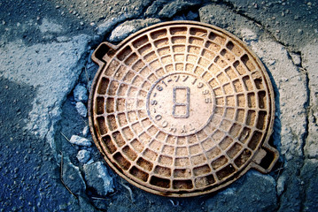 rusty manhole cover