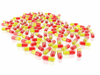 red and yellow pills on white background