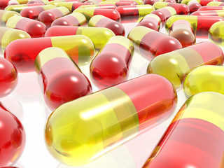 red and yellow pills on white background