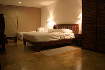 interior of a beach hotel bed room