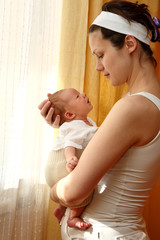 happy mother with newborn baby