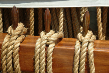 Fototapeta na wymiar ropes hung on deck of sailboat