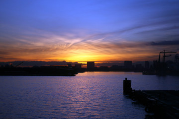view of amsterdam harbour at sundown