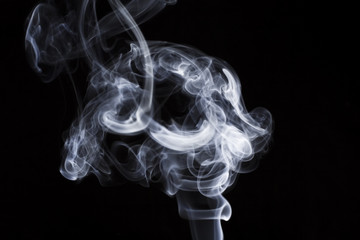 puff of aroma smoke on a dark background