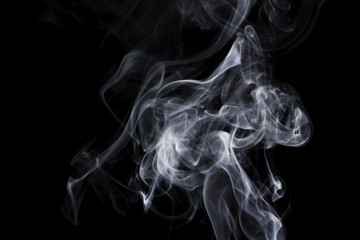 puff of aroma smoke on a dark background