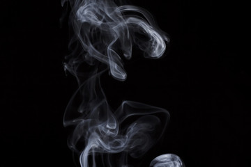 Obraz premium puff of aroma smoke on a dark background