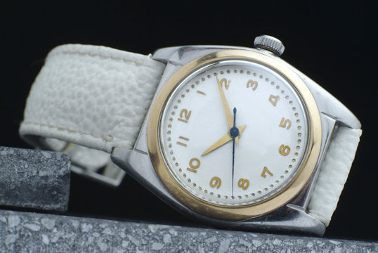vintage luxury watch with white strap