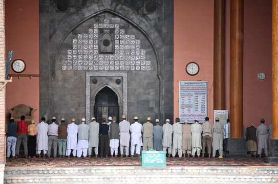 praying time in mosque. shrinagar, kashmir