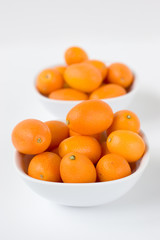 kumquats in bowls