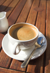 white coffee cup on wooden table