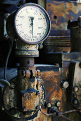 old gauge on a rusty machine