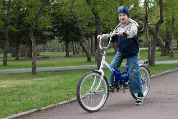 boy goes for a drive on a bicycle.