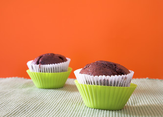 two muffins in green cups