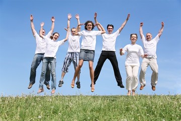 Seven friends in white T-shorts are in a jump